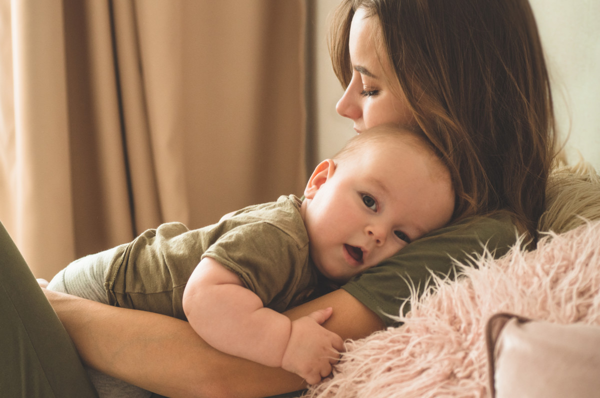 A mother holding her baby