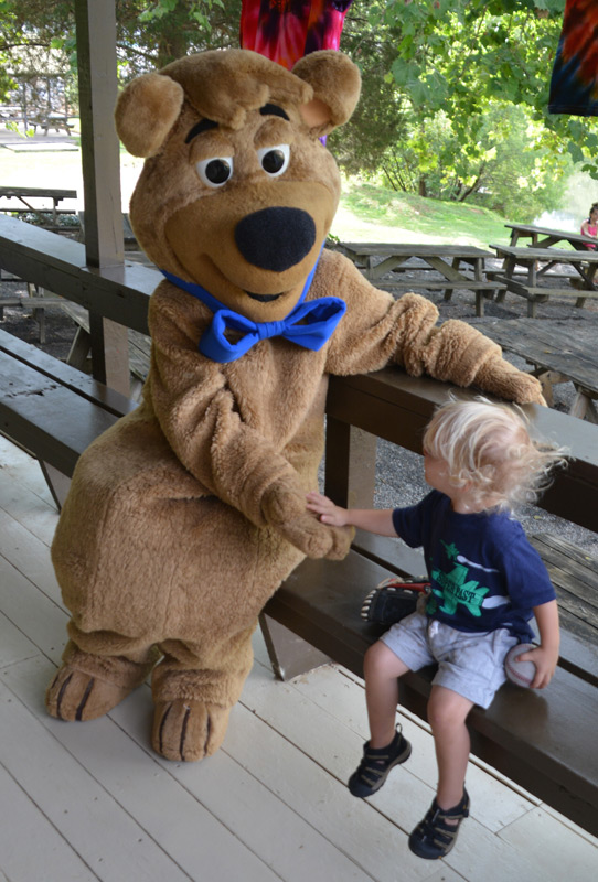 Boo Boo and Child Sitting on a Bench