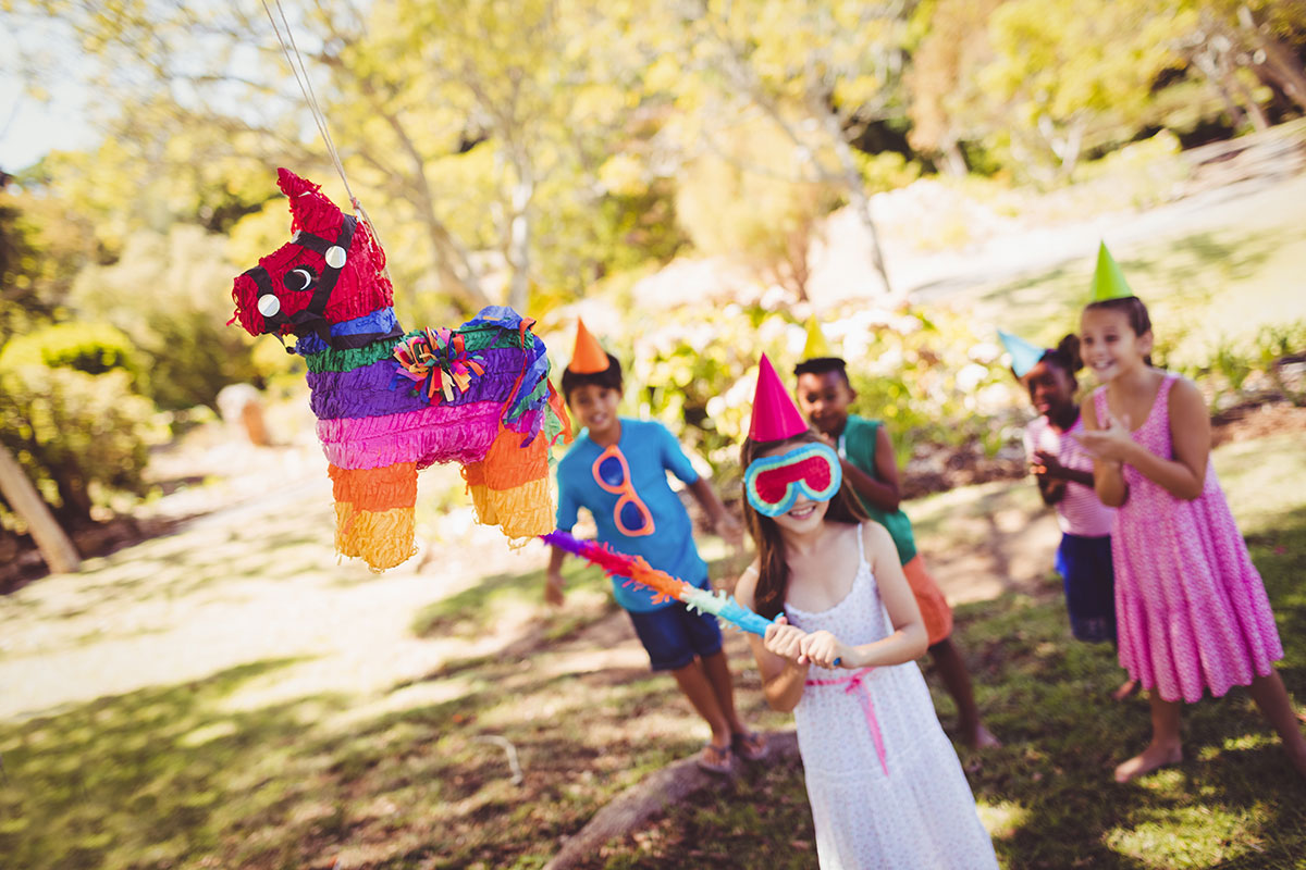 Children hitting a piñata